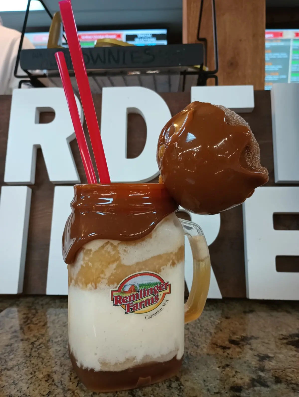 The Caramel Apple Delight — a caramel-rimmed jar drink topped with a whole caramel apple