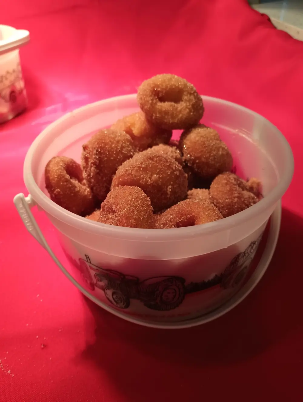 A pail of pumpkin pie spiced mini-donuts tossed in cinnamon sugar