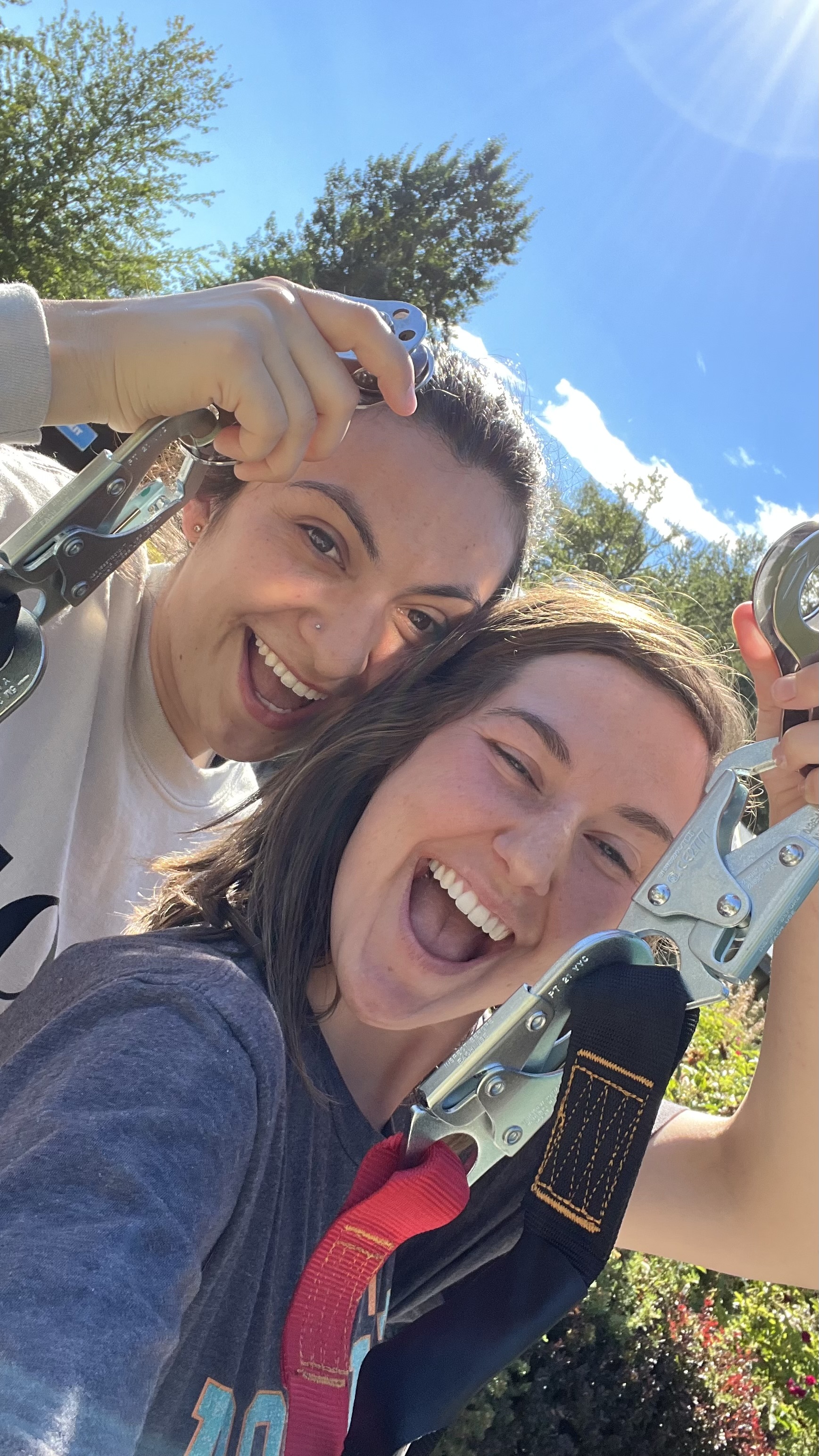 Two friends laughing on the Remlinger Farms zip line