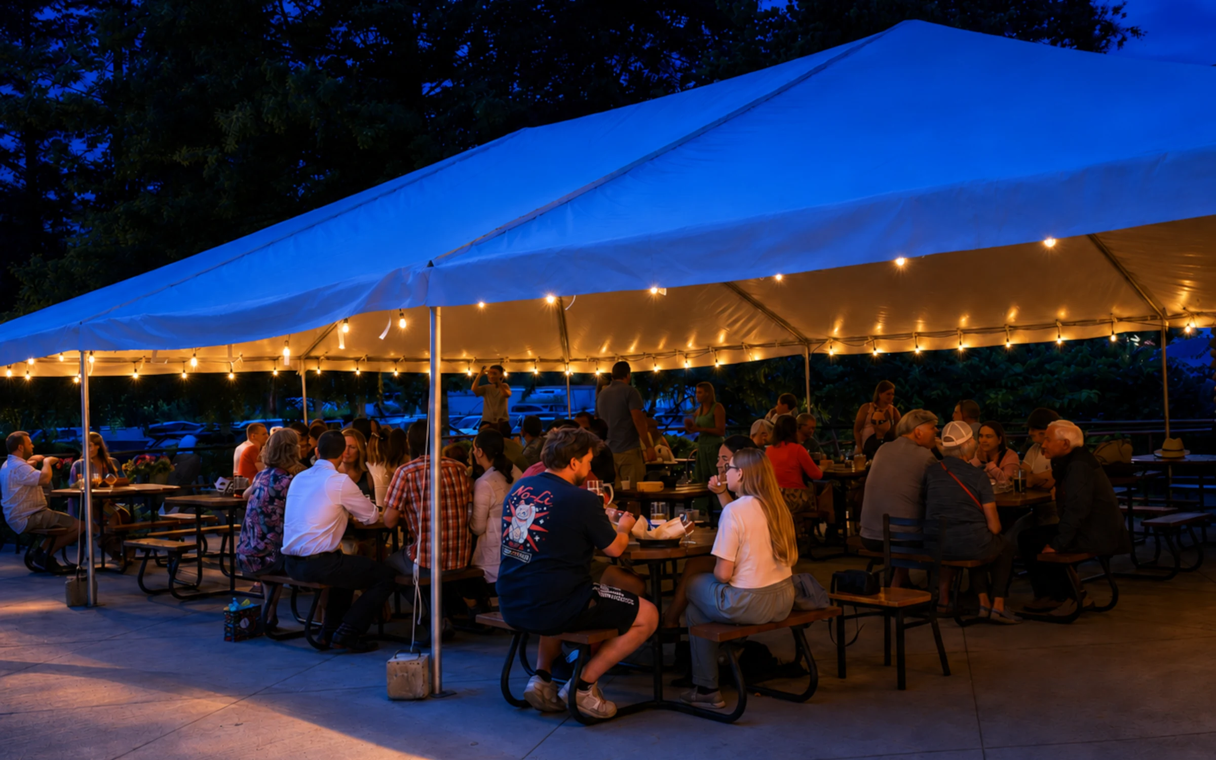 Friends celebrating with dinner and live music inside Remlinger Farms Brewery