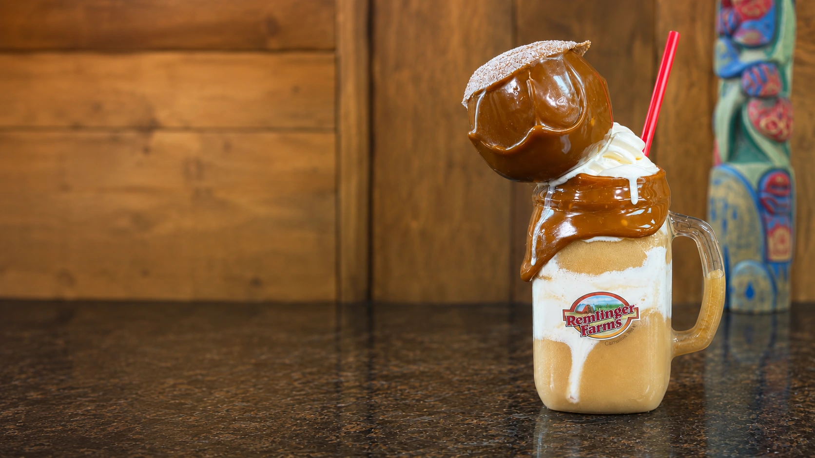 The Caramel Apple Delight — a caramel-rimmed jar drink topped with a whole caramel apple